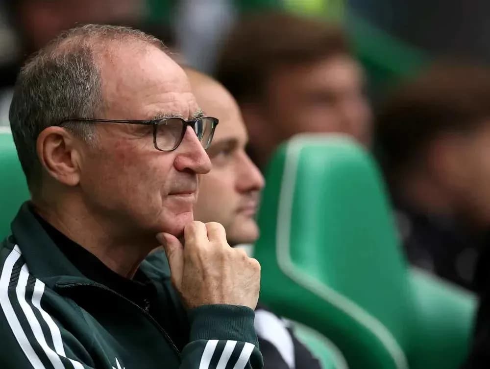 Coach observing the game from the bench Coach observing the game from the bench