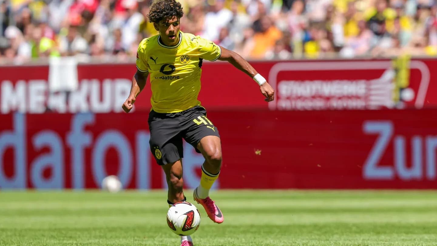 Player dribbling the ball during match for Borussia Dortmund Player dribbling the ball during match for Borussia Dortmund