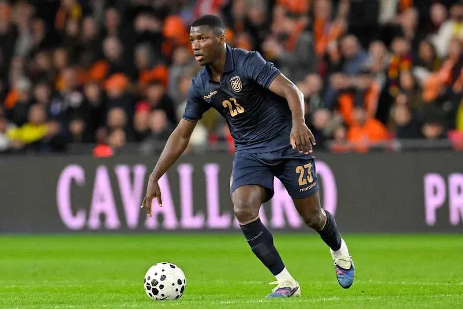 Player in blue kit running with soccer ball Player in blue kit running with soccer ball
