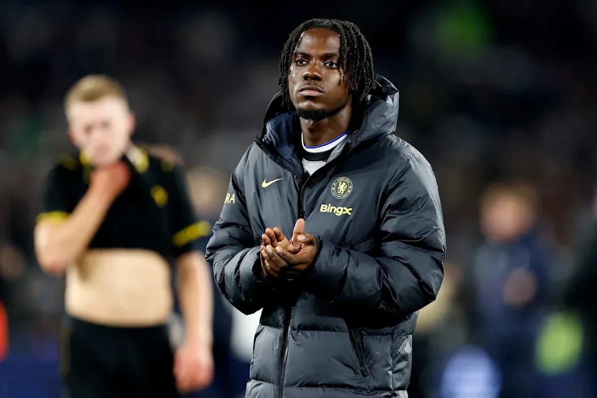 Chelsea player in jacket clapping after match Chelsea player in jacket clapping after match