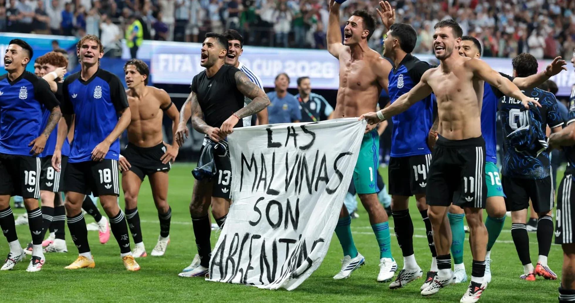 Argentina players celebrating with a banner after match Argentina players celebrating with a banner after match