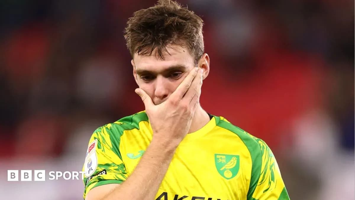 Player in yellow kit looks disappointed after match Player in yellow kit looks disappointed after match