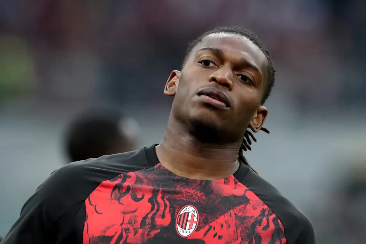 Player warming up in AC Milan training shirt Player warming up in AC Milan training shirt