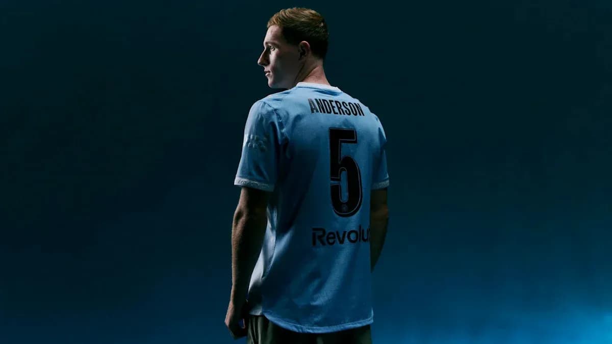 Player in light blue jersey with number 5 Player in light blue jersey with number 5