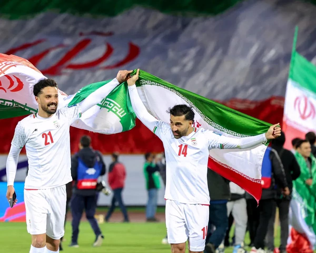 Iran players celebrating with national flags Iran players celebrating with national flags