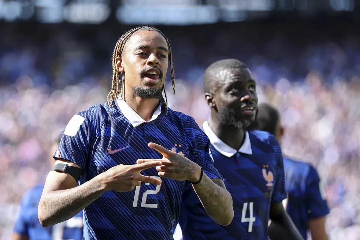 Two France players celebrating during a match Two France players celebrating during a match