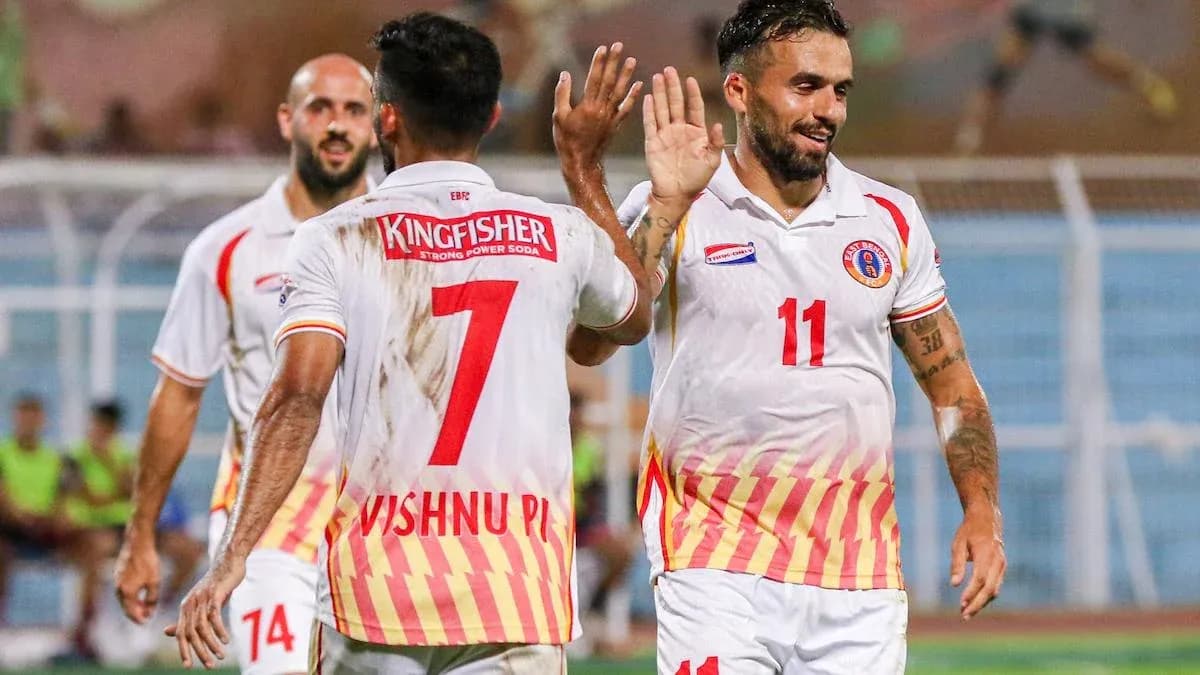 Players celebrating a goal during a match Players celebrating a goal during a match