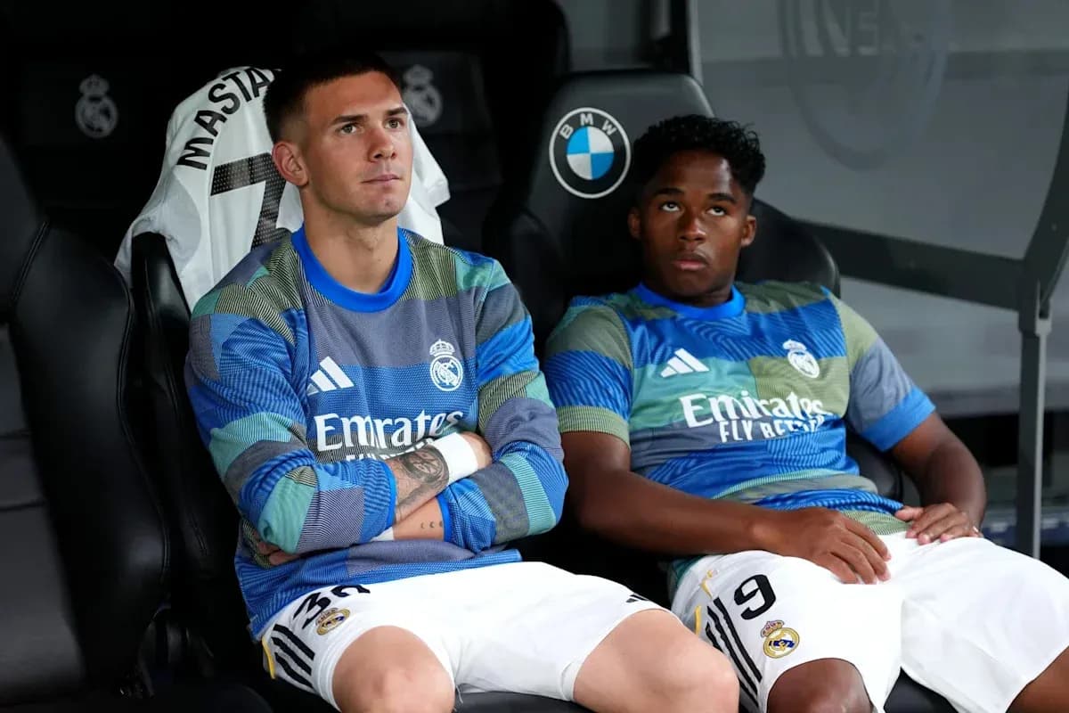 Two Real Madrid players sitting on the bench Two Real Madrid players sitting on the bench