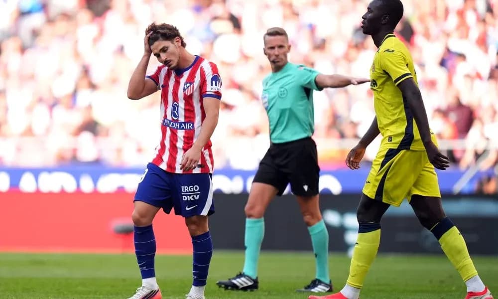 Atletico player reacting to referee's decision during match Atletico player reacting to referee's decision during match