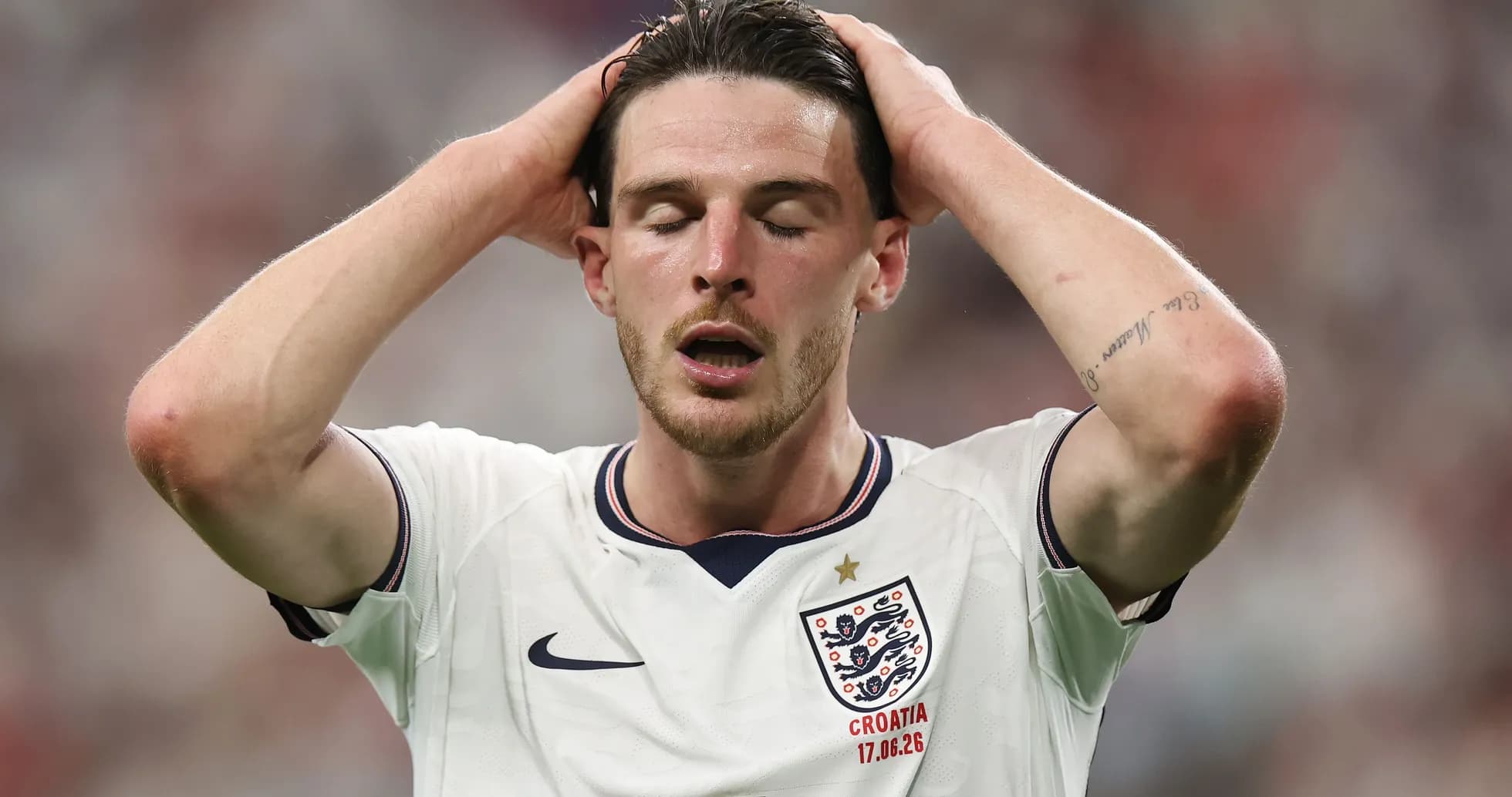 Player in England jersey with hands on head Player in England jersey with hands on head