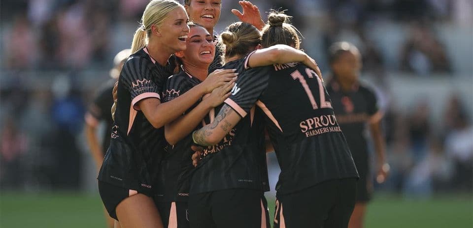 Players celebrating after scoring a goal Players celebrating after scoring a goal