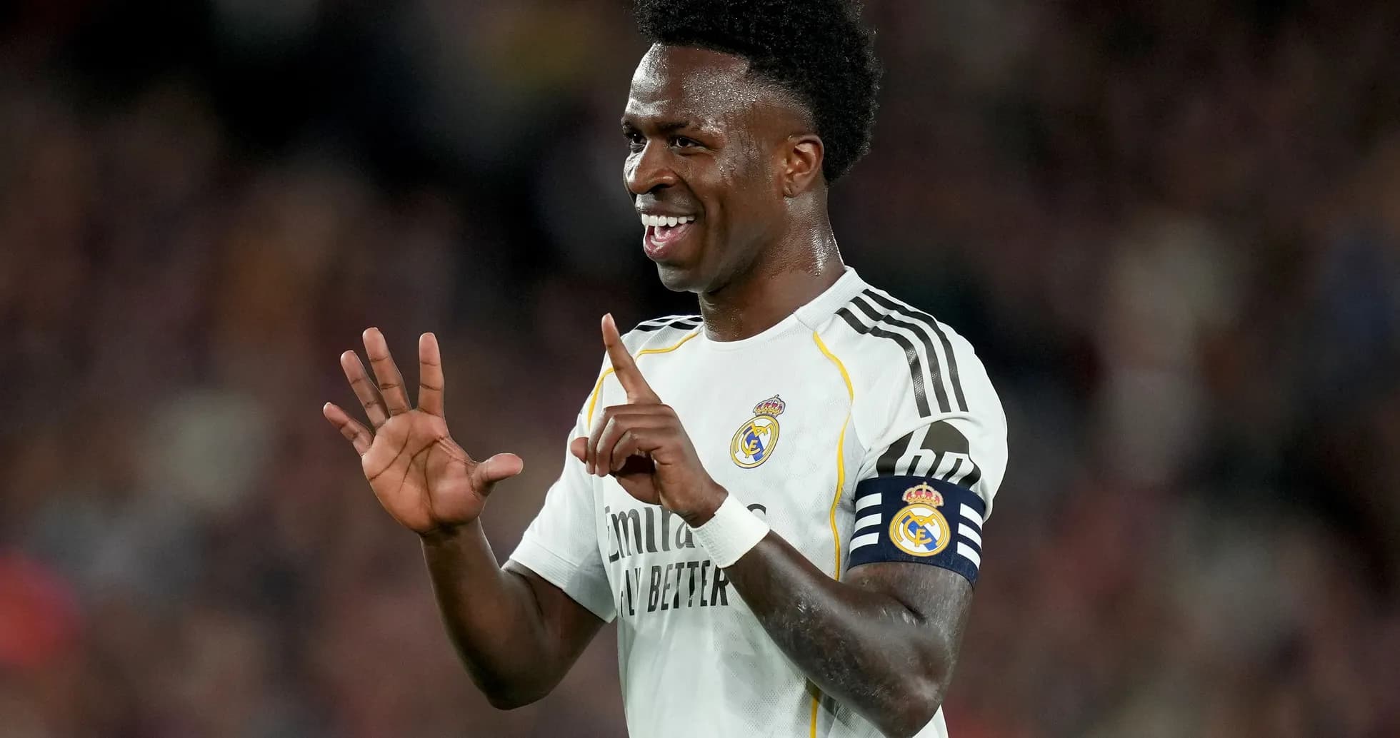 Player celebrating with a hand gesture on field Player celebrating with a hand gesture on field
