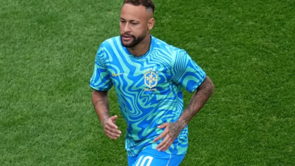 Player wearing Brazil kit running on the field Player wearing Brazil kit running on the field