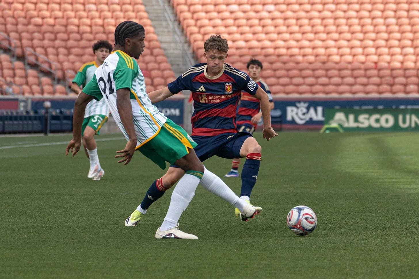 Player tackling opponent during MLS Next Pro match Player tackling opponent during MLS Next Pro match
