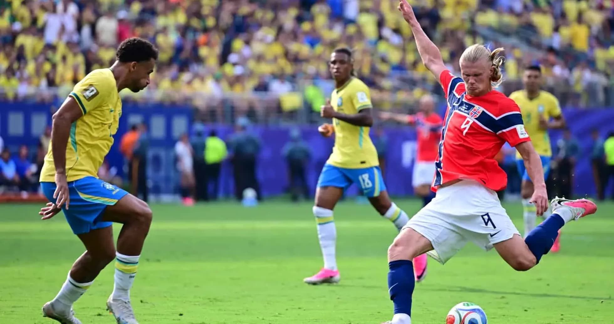 Brazil player challenging Norway player during match Brazil player challenging Norway player during match