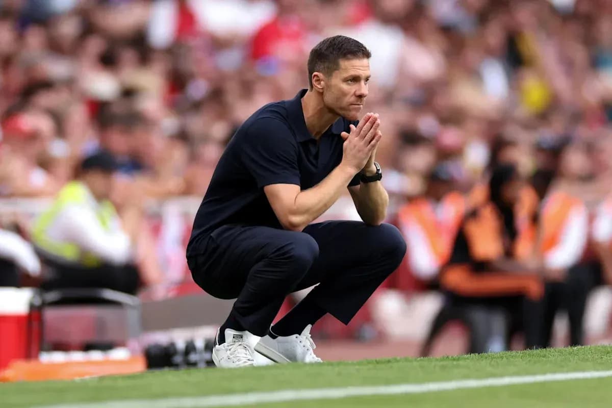 Coach crouching on the sideline during match Coach crouching on the sideline during match