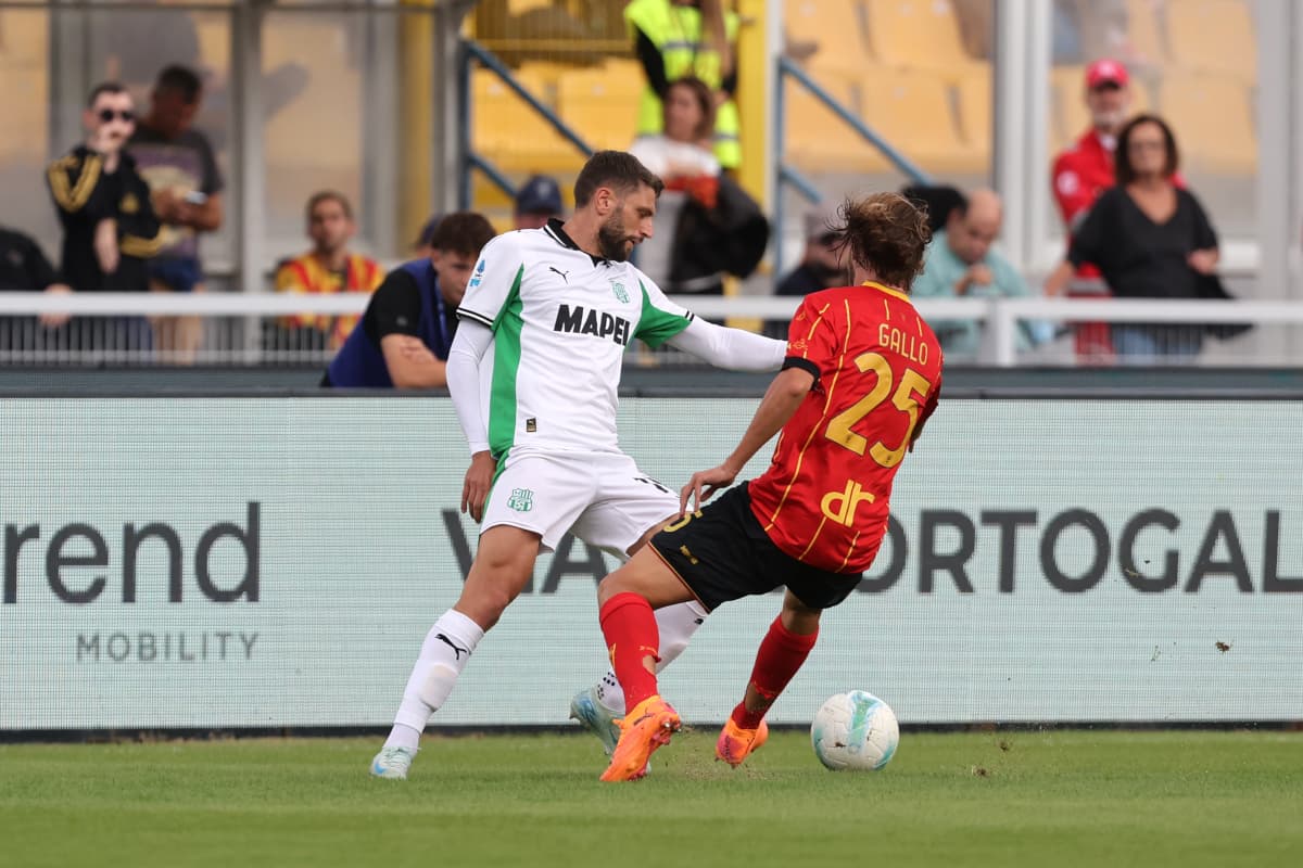Player challenging for the ball during Serie A match Player challenging for the ball during Serie A match