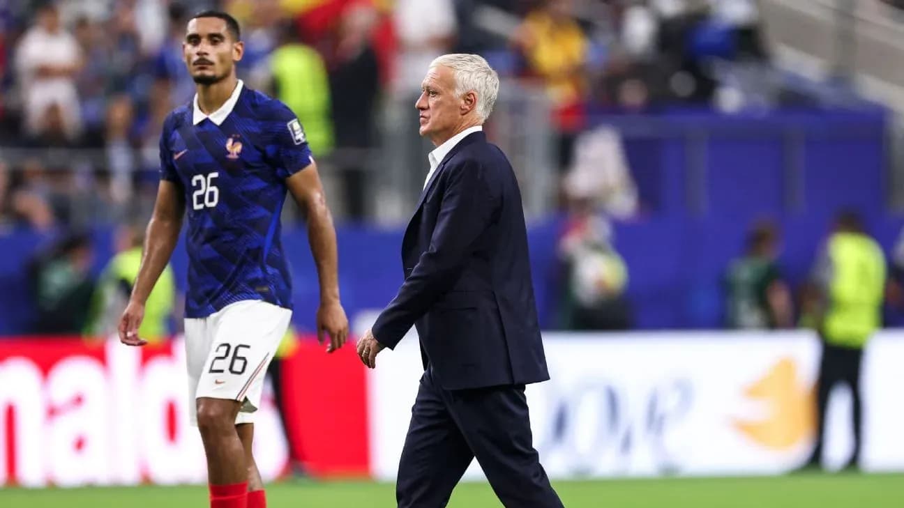 France coach Didier Deschamps walking past player 26 France coach Didier Deschamps walking past player 26